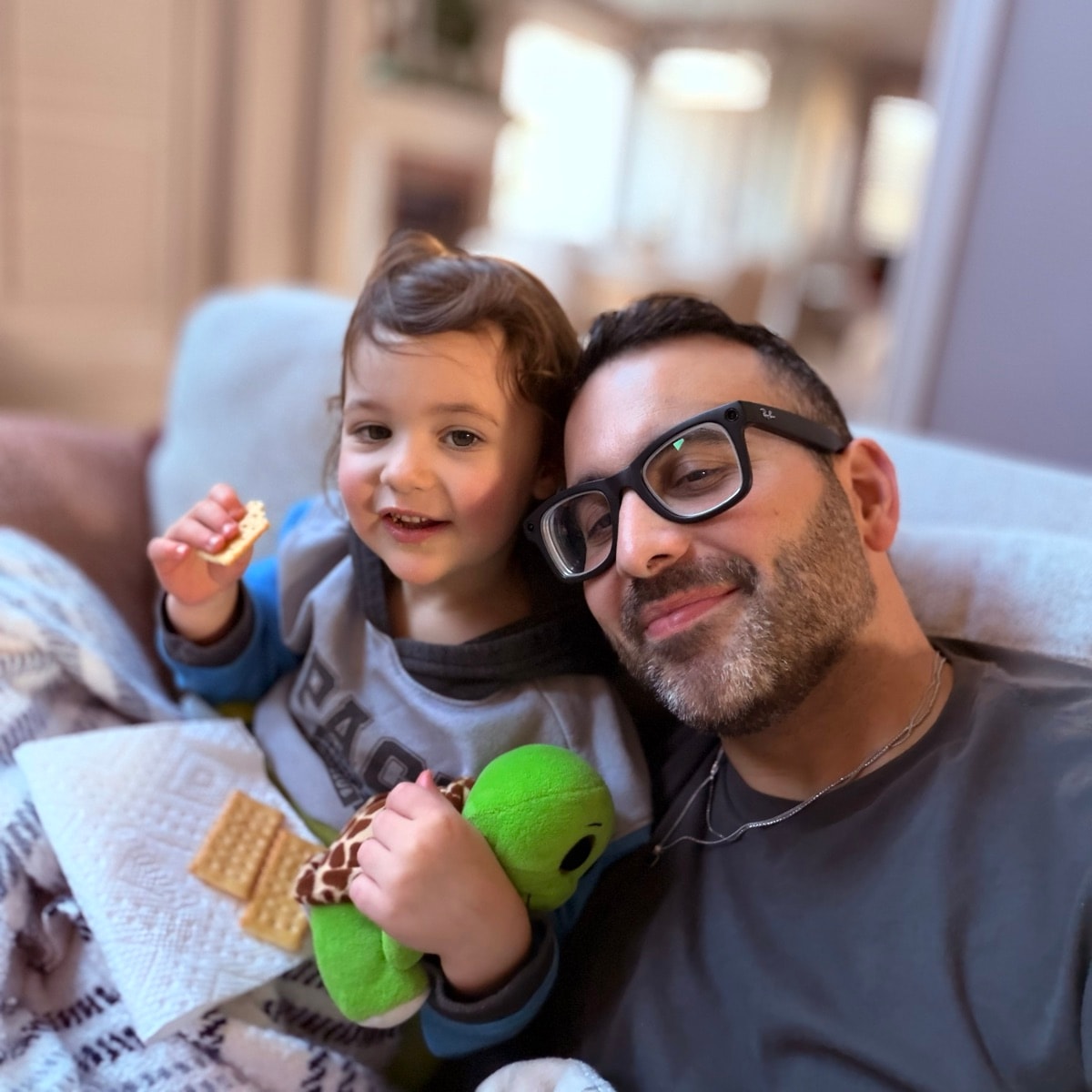 Gene at home with his child